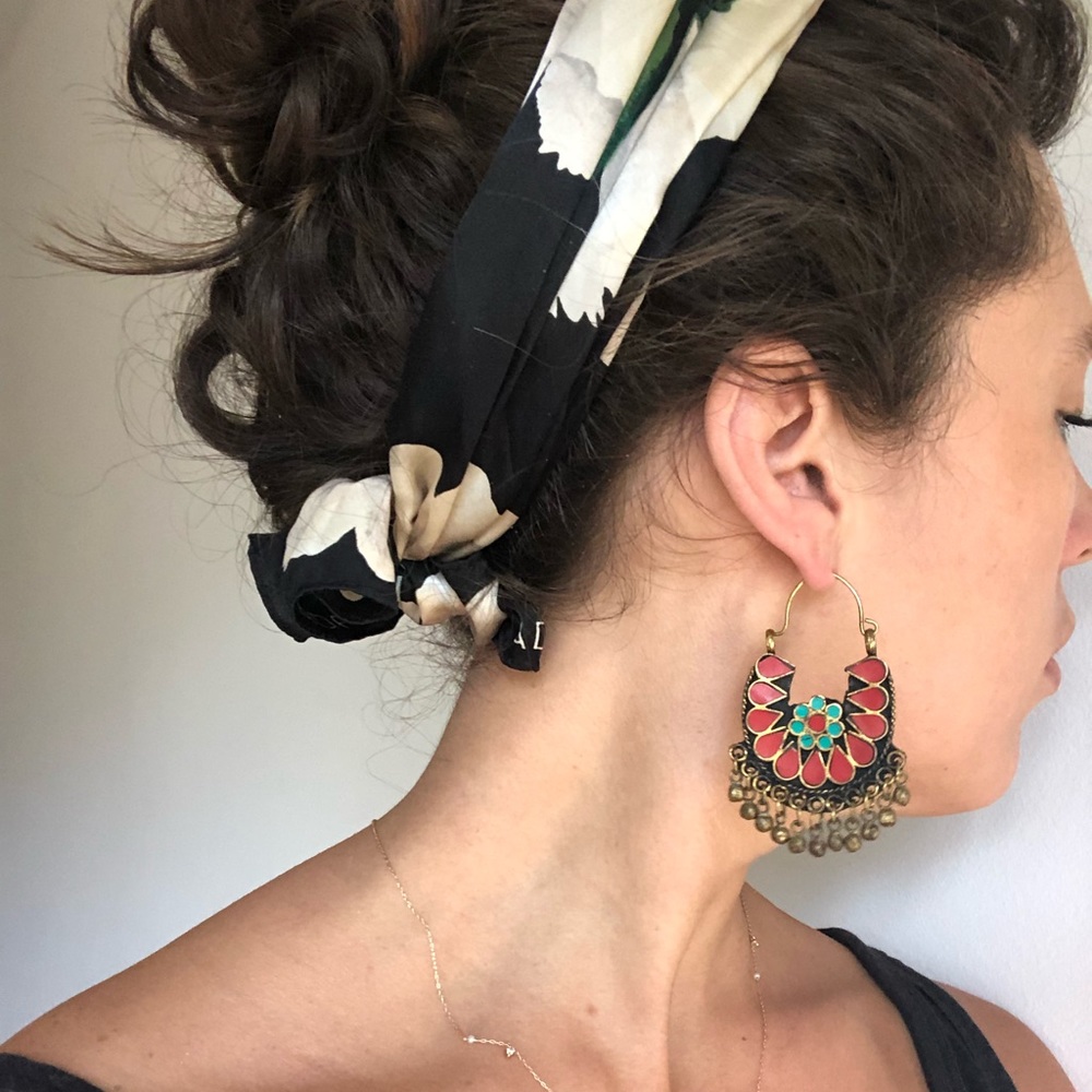Coral and turquoise dangling hoop earrings.